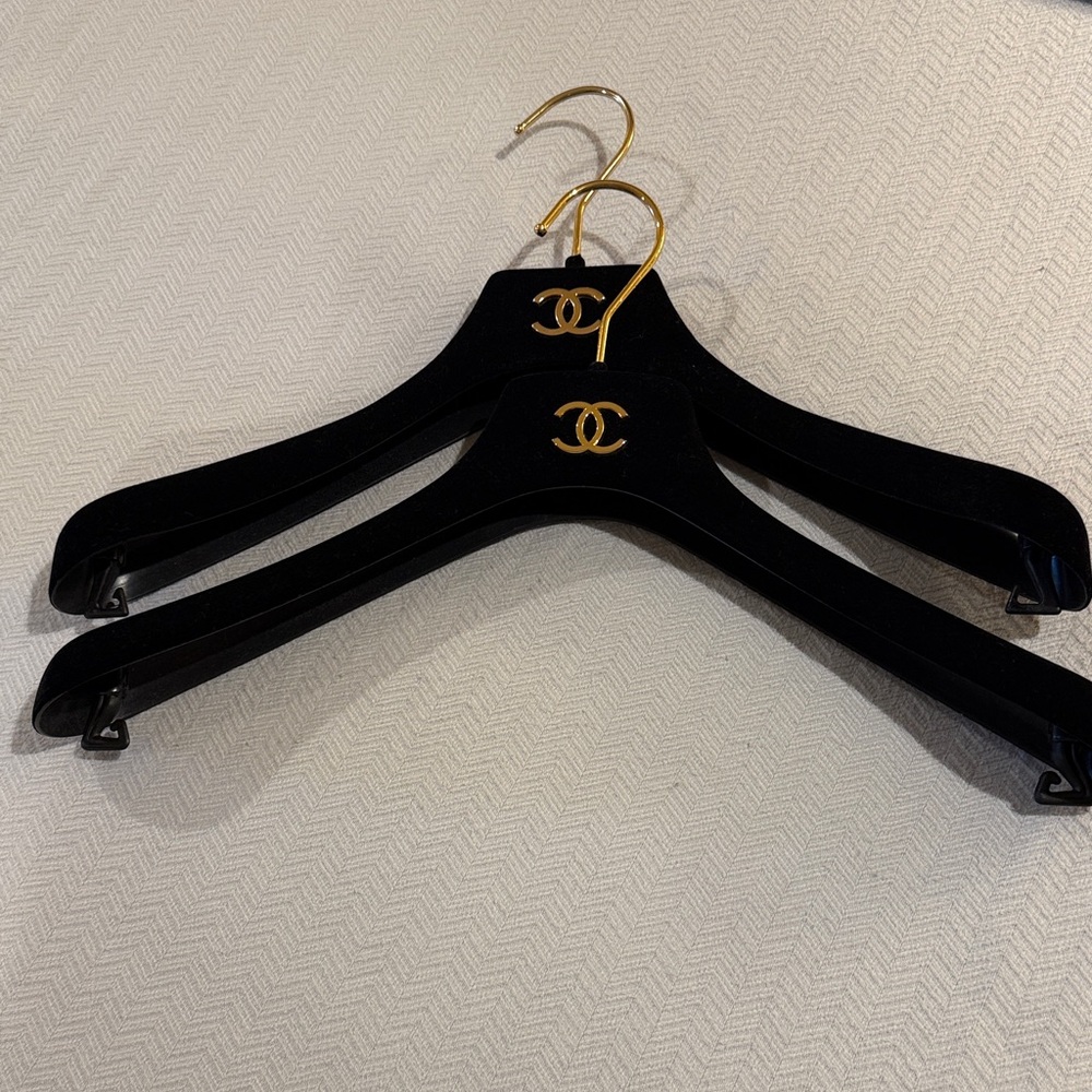 CHANEL Black Hangers with Gold Accents